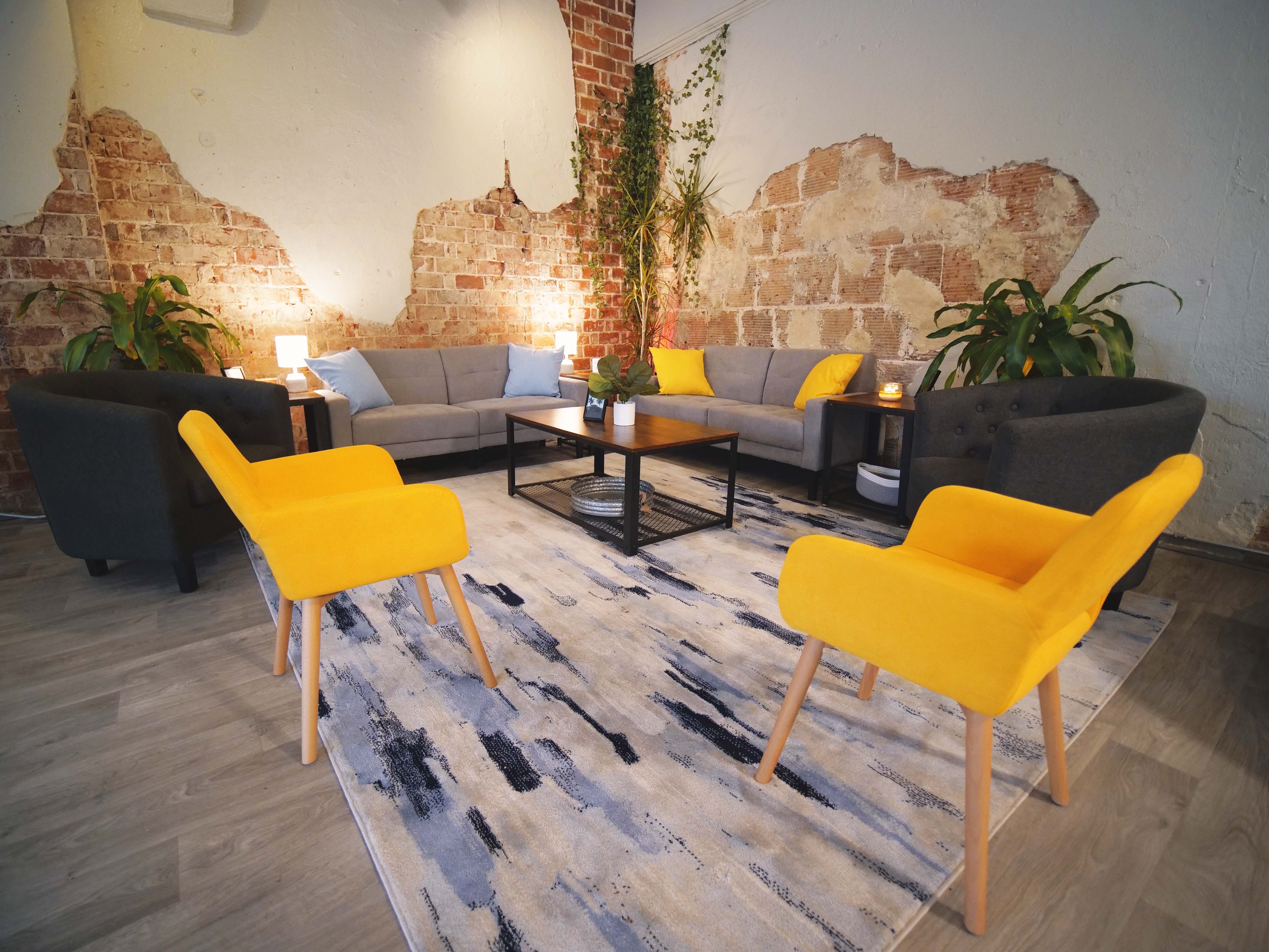 Unwind on Central lounge with exposed brick